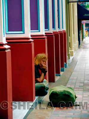 The harmonica player is oblivious to everything but his music.&nbsp;The street echoes his song.&nbsp;Shot with a Canon Powershot Pro 1 camera in Nashville, TN.